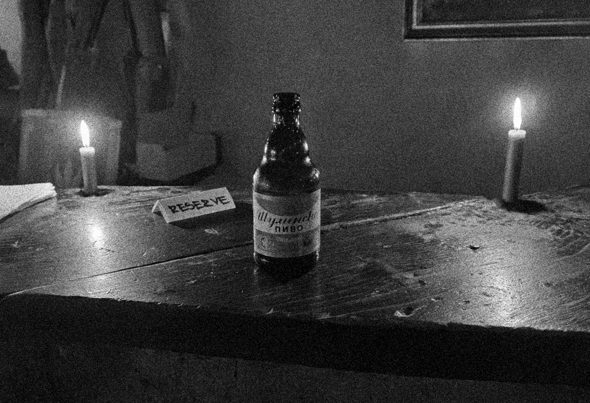 beer and two candles as a black and white photo